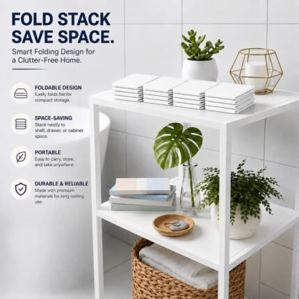 Folded white bathroom mats stacked on a storage shelf displaying the space saving design.