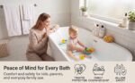 A mother watching her toddler play in a bathtub equipped with a white non-slip mat, displaying the family safety icons below.